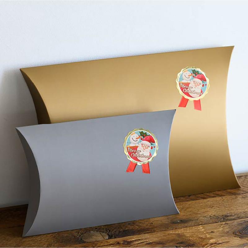 ギフト資材 XPL-1S 愉快なクリスマスリボン型シール-1(100枚) ヘッズ