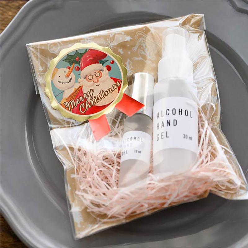 ギフト資材 XPL-1S 愉快なクリスマスリボン型シール-1(100枚) ヘッズ