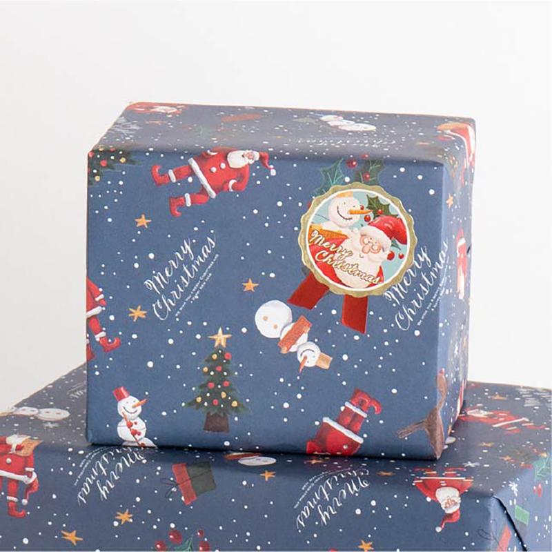 ギフト資材 XPL-1S 愉快なクリスマスリボン型シール-1(100枚) ヘッズ